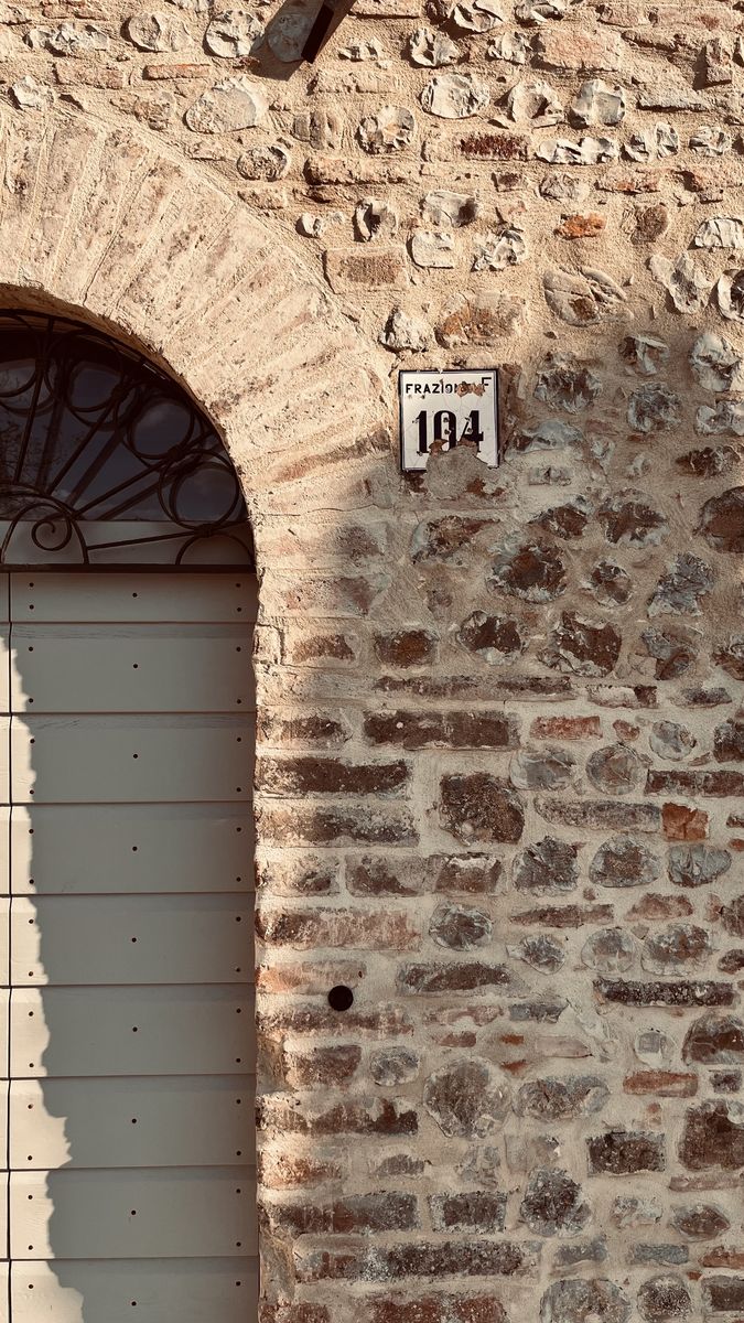 Brick arch with the restored stone and brick masonry