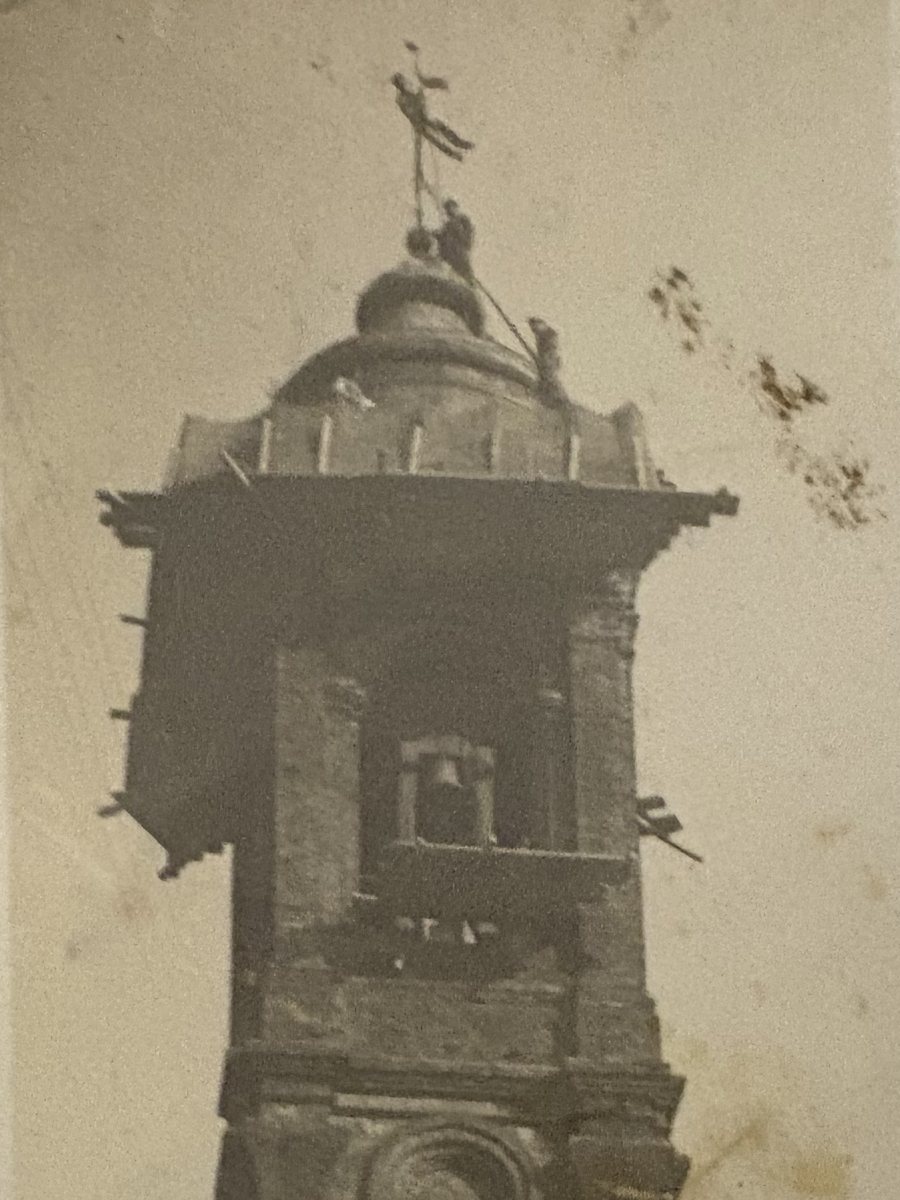 Historic sepia photograph of Gisleno Scargiali at work on the dome of the Cathedral bell tower