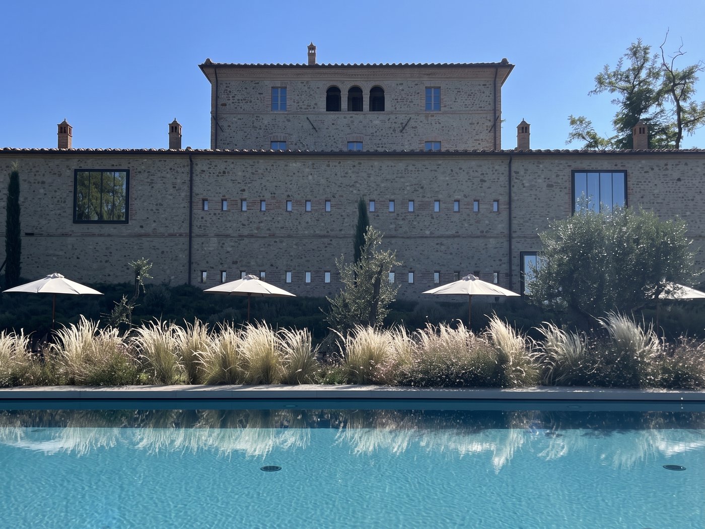 The farmhouse of Ca' Litardo seen from the pool