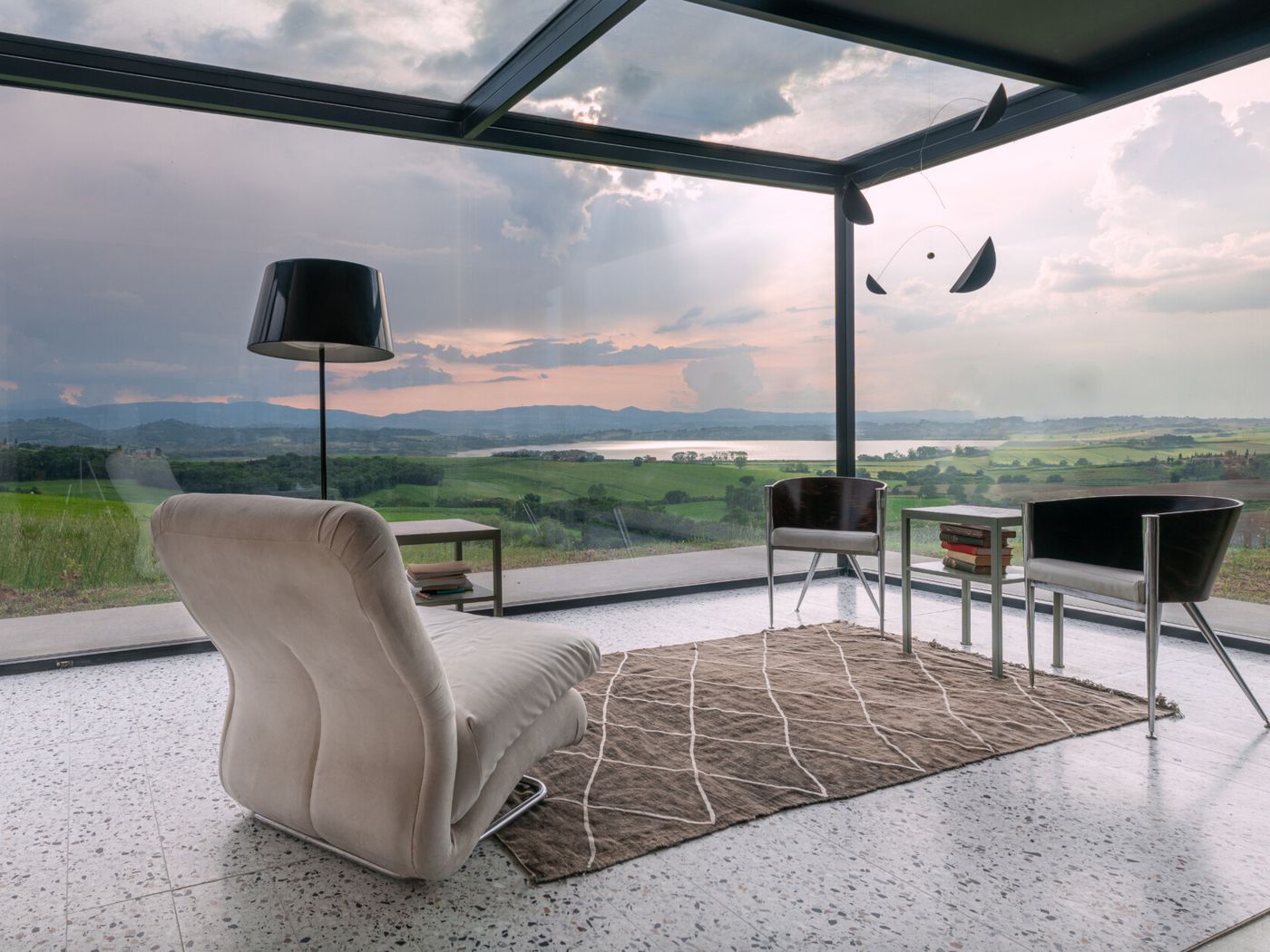 Kitchen of La Casa sul Chiaro with a continuous window onto the hills around Lake Chiusi