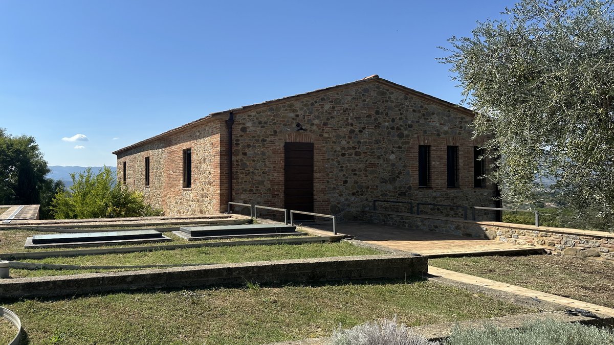 The stone building today, with the lawn, the skylights and the path